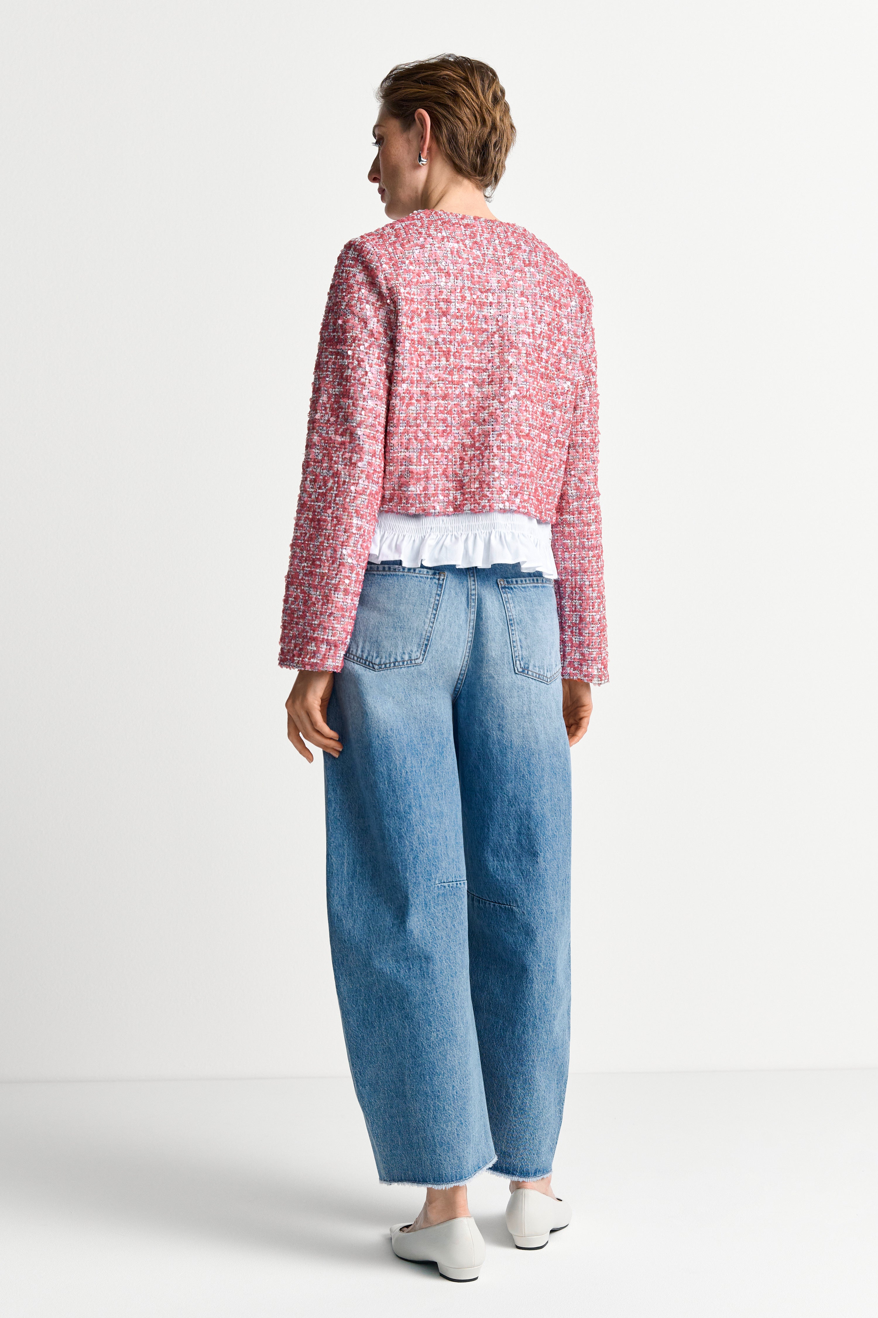 Bouclé Jacke mit Peplum-Saum